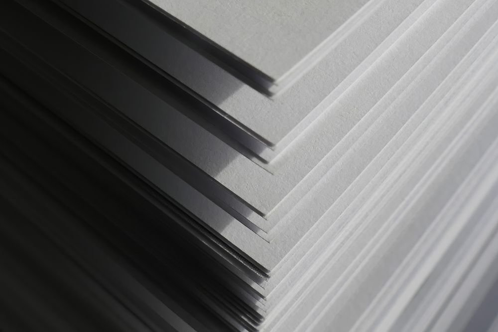 Stack of white paper sheets for paper coating and filling applications